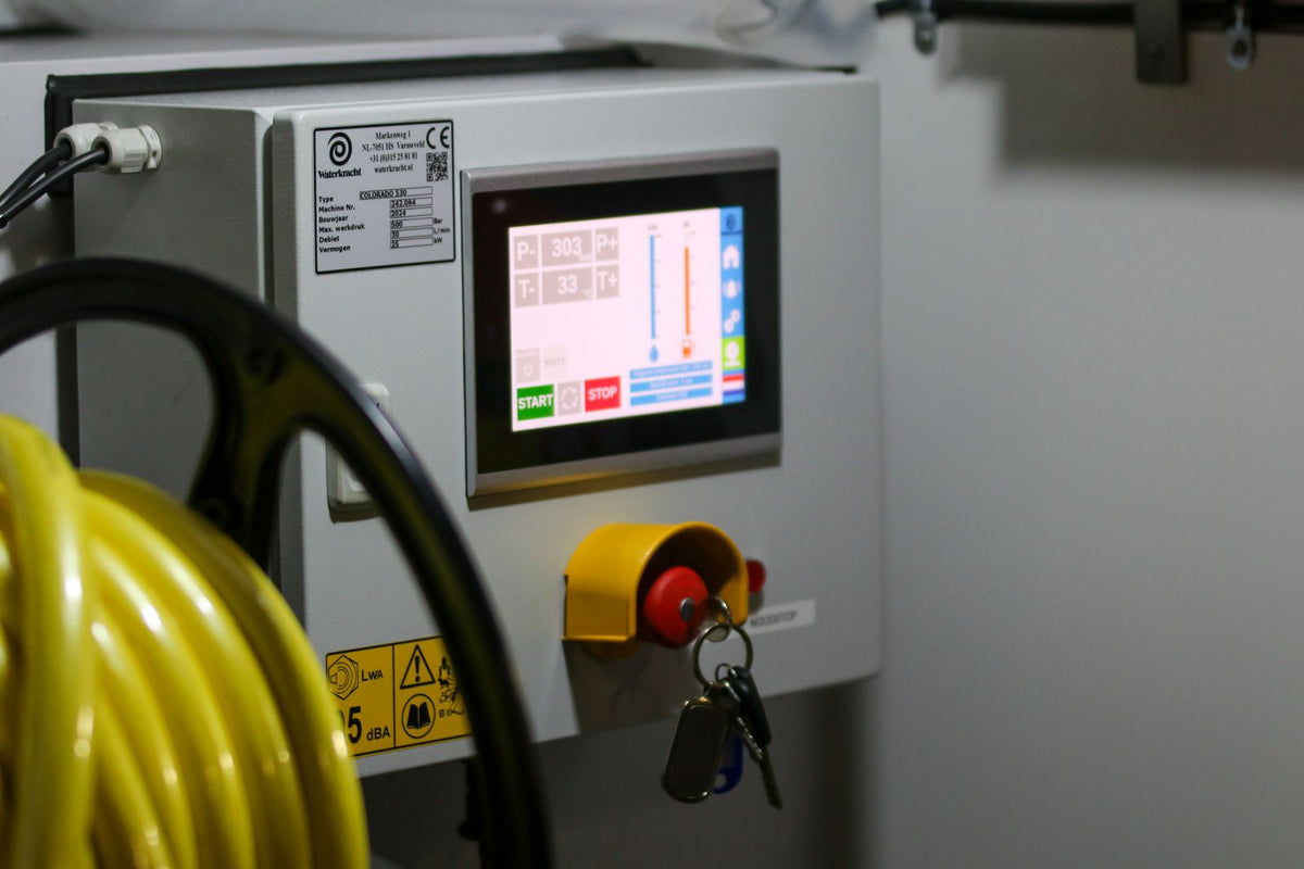 Industrial machine control panel with an operator screen and controls