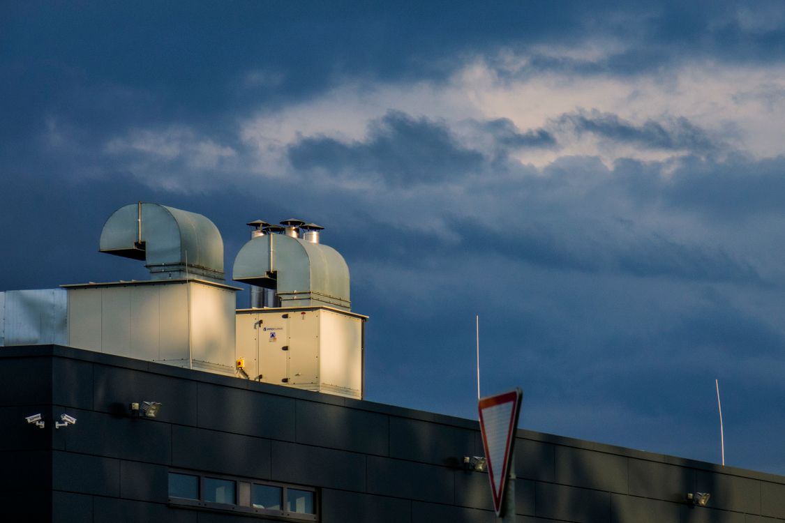 Stock photograph of rooftop ventilation ductwork on an industrial building