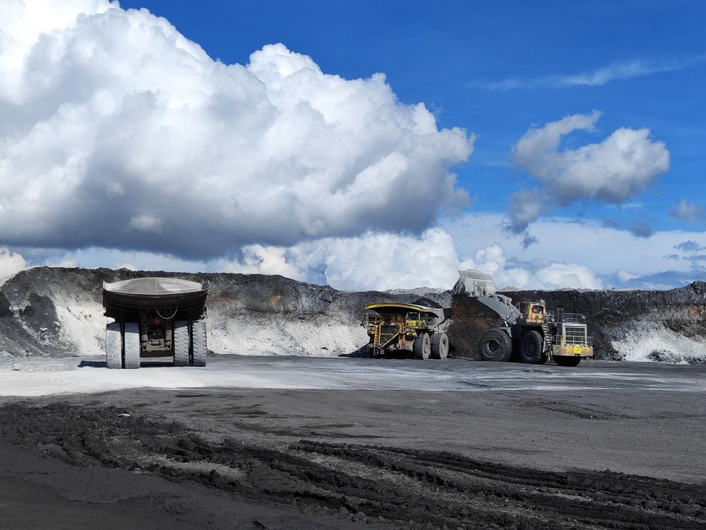 Stock photograph of an open-pit mine with excavation equipment